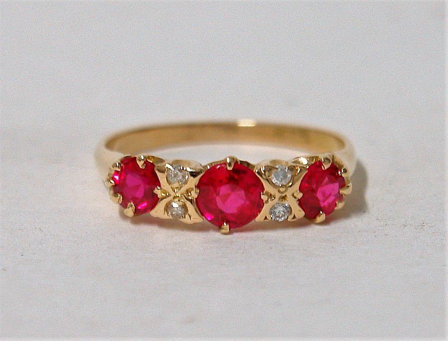 An 18ct. yellow gold estate diamond and synthetic ruby ring,… - Rings