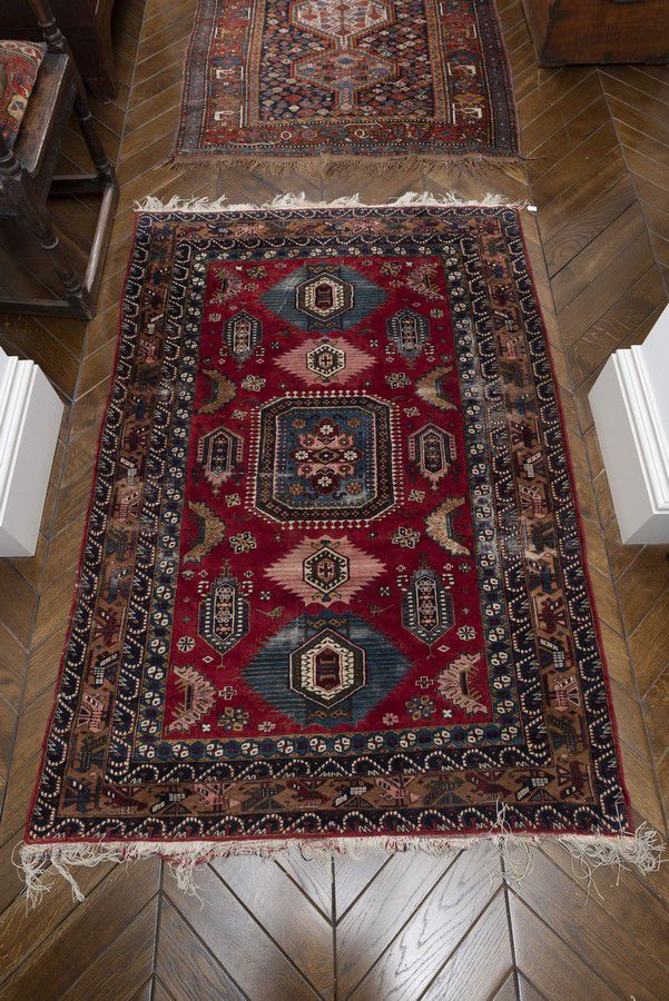 A Persian rug, 2nd half 20th century, decorated with a central… Rugs
