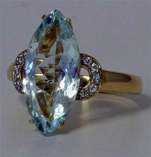 An aquamarine and diamond ring; marquise cut aquamarine of… - Rings ...