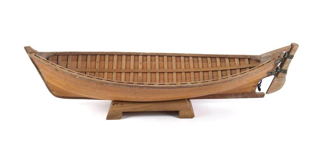 A clinker model boat made from huon pine boards with 