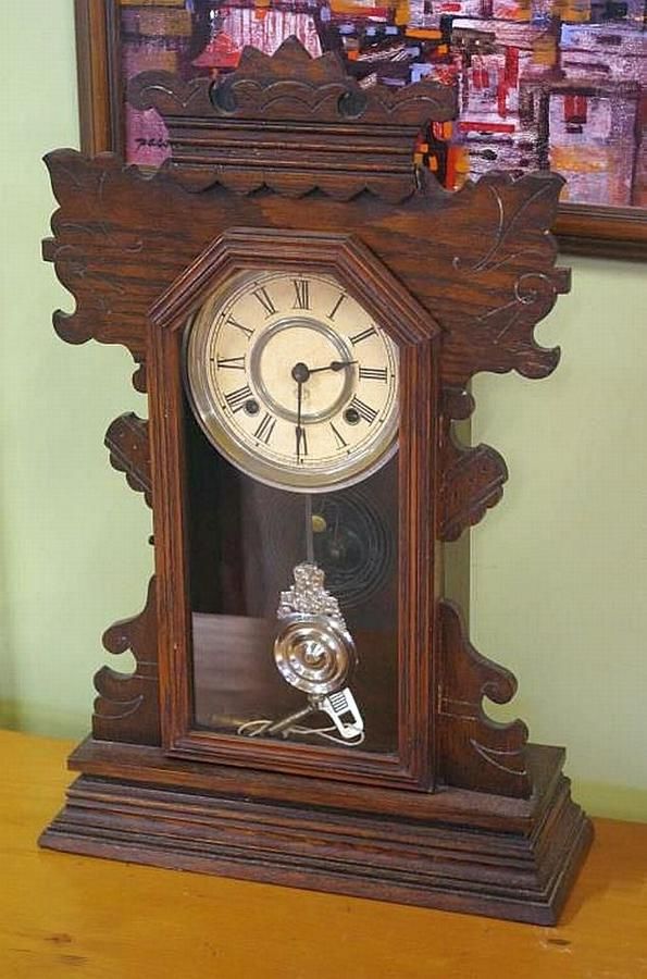 Antique Ansonia mantle clock in carved timber case, 56 cm high - Clocks