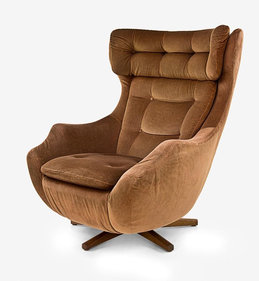 Parker Knoll wing back brown swivel chair, raised on a